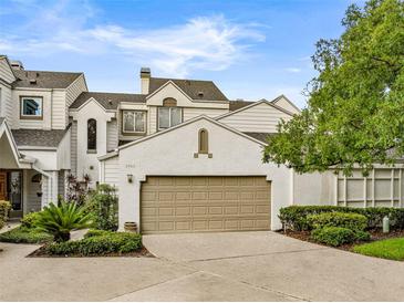 Charming home featuring a two-car garage, well-maintained landscaping, and neutral color palette at 3966 Villas Green, Longwood, FL 32779