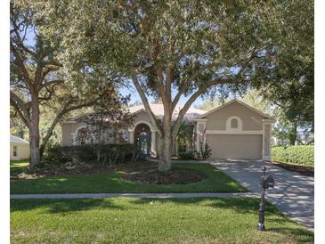 Charming single-story home with a well-manicured lawn, mature trees, and inviting curb appeal at 636 Cheviot Ct, Apopka, FL 32712