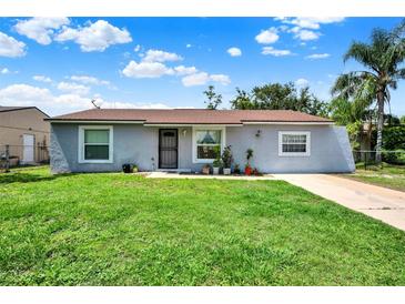 Charming single-story home with a well-maintained lawn and inviting curb appeal at 7807 Pine Hawk Ln, Orlando, FL 32822