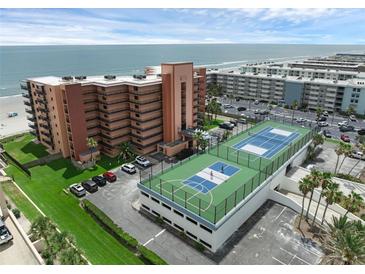 Coastal condo building showcasing the ocean view and rooftop tennis courts at 4141 S Atlantic Ave # 707, New Smyrna Beach, FL 32169
