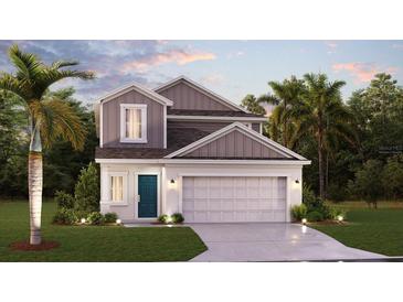 Charming two-story home featuring manicured landscaping and a two-car garage at 7881 Marlow Pl, Kissimmee, FL 34746