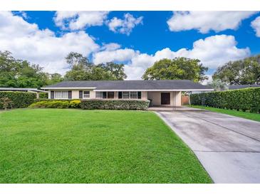 Charming single-story home with a well-maintained lawn and covered carport in a desirable neighborhood at 2809 Sanbina St, Winter Park, FL 32789