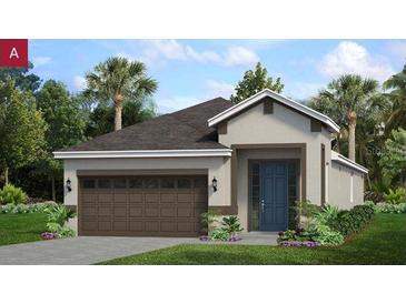Charming single-story home with a two-car garage and beautifully landscaped front yard at 1198 Atlantic Ave, Fruitland Park, FL 34731
