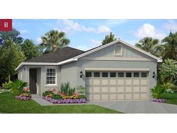 Charming one-story home featuring a spacious two-car garage and inviting, well-maintained landscaping at 746 Lemon Ave, Fruitland Park, FL 34731