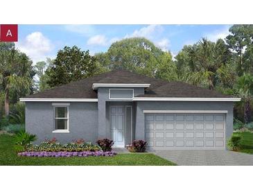 Charming single-story home with well-manicured lawn and an attached two-car garage in a quiet neighborhood at 778 Lemon Ave, Fruitland Park, FL 34731
