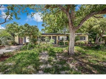 Charming single-story home with mature trees and a well-maintained lawn at 905 Flewelling Ave, Ocoee, FL 34761