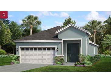 Charming single-story home featuring an attached two-car garage, a welcoming front door, and manicured landscaping at 1214 Atlantic Ave, Fruitland Park, FL 34731