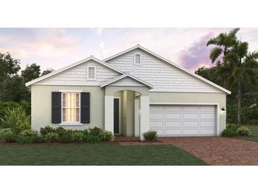 Charming single-story home featuring a two-car garage and well-manicured landscaping at 5850 Ali Grace Dr, St Cloud, FL 34771