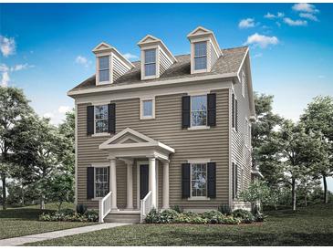 Charming three-story home with dormer windows, black shutters, and a covered front porch at 1896 Seawall Way, Celebration, FL 34747
