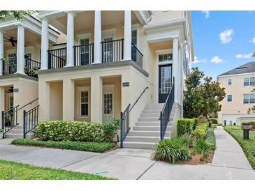 Inviting townhome with a classic design, well-manicured landscaping and a welcoming front entrance at 2058 Prospect Ave, Orlando, FL 32814