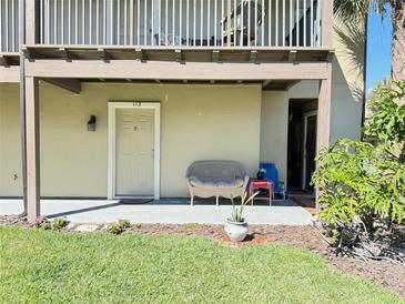 Inviting condo entrance with a cozy seating area and well-maintained landscaping at 249 Afton Sq # 112, Altamonte Springs, FL 32714
