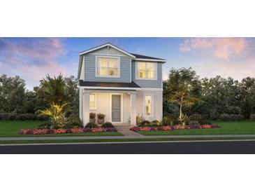 Charming two-story home with landscaped yard, covered porch, and craftsman details at 2552 Long Pine Ave, Apopka, FL 32712