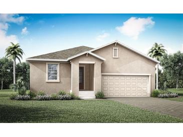 Charming single-story home with a two-car garage, landscaped yard and neutral color palette at 420 Free Range Dr, Clermont, FL 34715