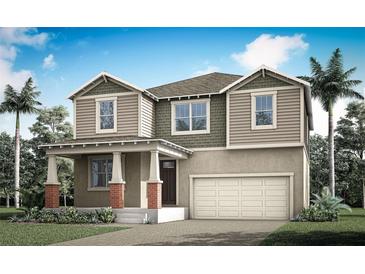 Charming two-story home with a welcoming front porch, attached two car garage, and lush landscaping at 466 Free Range Dr, Clermont, FL 34715