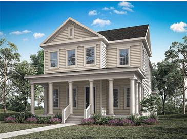 Inviting two-story home with a charming front porch and classic architectural details at 1969 Beach Ter, Celebration, FL 34747