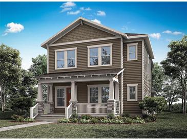 Charming two-story home showcasing a covered front porch and inviting curb appeal at 2486 Celebration Blvd, Celebration, FL 34747
