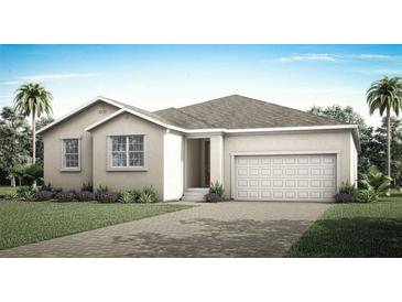Charming single-story home featuring a two-car garage, landscaped yard, and a neutral color palette at 336 Free Range Dr, Clermont, FL 34715