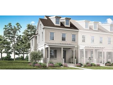 Charming two-story home with a welcoming front porch and manicured lawn at 2374 Celebration Blvd, Celebration, FL 34747