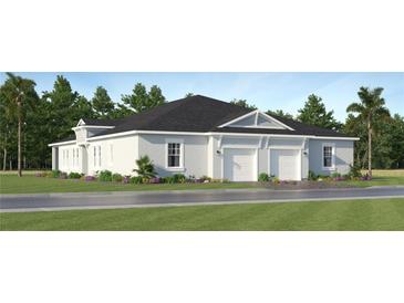 Charming single-story home with a well-maintained lawn, two-car garage, and inviting curb appeal at 4335 Curacao Pl, Kissimmee, FL 34758
