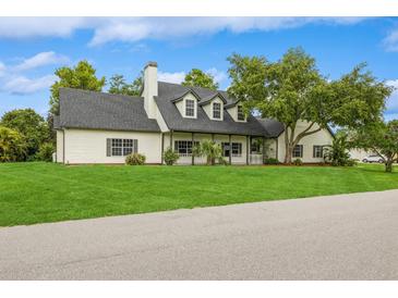 Charming two-story home with a manicured lawn and inviting front porch at 1660 Justin Matthew Way, St Cloud, FL 34771