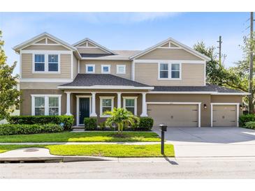 Charming two-story home with a well-manicured lawn and a three-car garage at 2071 Remembrance Ave, St Cloud, FL 34769