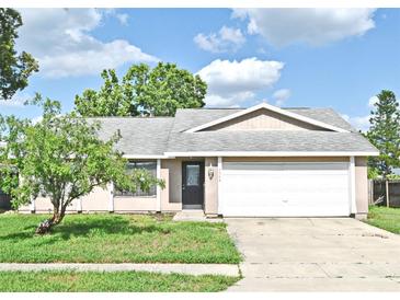 Charming single-story home with a well-maintained lawn and inviting curb appeal at 5588 Garden Grove Cir, Winter Park, FL 32792