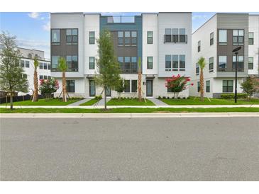 Modern townhomes boast striking architecture, lush landscaping, and inviting entryways at 2290 Brix Sts, Orlando, FL 32804