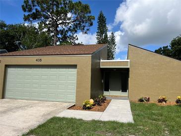 Charming single-Gathering home with a two-car garage and tidy landscaping in a quiet neighborhood at 435 Boxwood Cir, Winter Springs, FL 32708