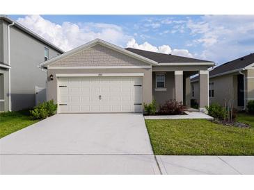Charming single-story home featuring a neutral color palette and a spacious two-car garage at 1792 Bull Hill Rd, Kissimmee, FL 34744
