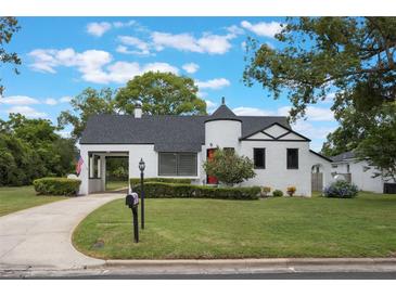 Charming home featuring unique architectural elements and well-maintained landscaping at 2101 Lily Ct, Sanford, FL 32771