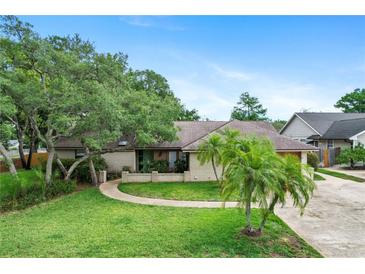 Charming single story home with a beautifully landscaped front yard and inviting walkway at 283 Haverclub Ct, Longwood, FL 32779
