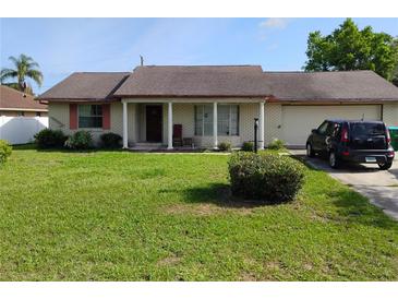 Charming single-story home with a well-maintained lawn, and a brick exterior at 1152 Ring St, Deltona, FL 32725