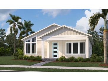 Inviting single-story home featuring a covered porch, modern front door, and well-manicured landscaping at 2971 Embark Trail, St Cloud, FL 34771