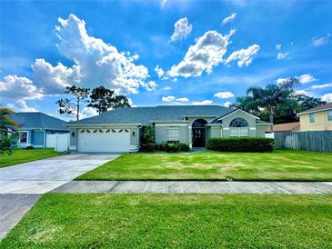 Charming single-story home features a well-manicured lawn and a two-car garage at 3708 Beaver Ridge Dr, Orlando, FL 32829