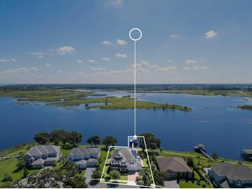 This property features a large yard, lake access, and is situated in a desirable neighborhood at 15787 Tangerine Dream Ct, Winter Garden, FL 34787