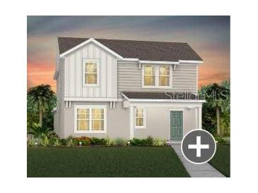 Charming two-story home with gray siding and a well-manicured lawn at 7432 Olivewood Ave, Orlando, FL 32829