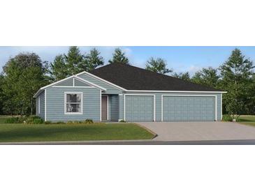 Charming single-story home with light blue siding, a two-car garage, and a well-manicured lawn at 8366 Sw 41St Ter, Ocala, FL 34476