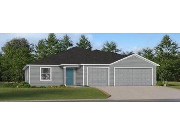 Charming one-story home with a two-car garage, a teal front door, gray siding and a manicured lawn at 8380 Sw 41St Ter, Ocala, FL 34476