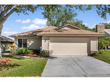 Charming single-story home features a two-car garage, well-maintained lawn, and beautiful landscaping at 1346 Palo Alto Ct, Winter Springs, FL 32708