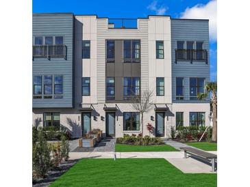Stylish townhome showcases modern architectural details and appealing landscaping at 2273 Valentine Aly, Orlando, FL 32804
