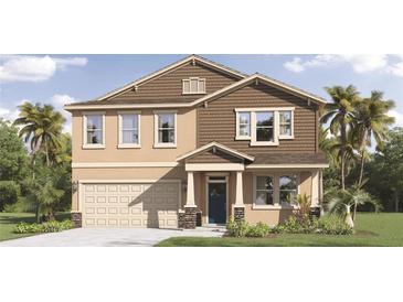Charming two-story home featuring a two-car garage, manicured lawn, and a mix of stucco and shingle siding at 3337 Arch Ave, Ormond Beach, FL 32174