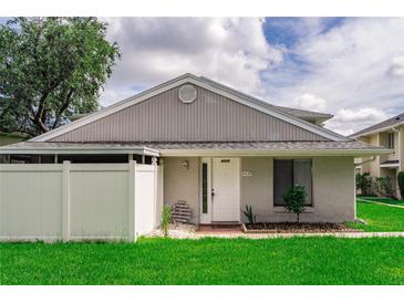 Charming single-story home featuring a lovely front door, complemented by a well-manicured lawn and a cozy, inviting entrance at 4438 Pinebark Ave # 4, Orlando, FL 32811