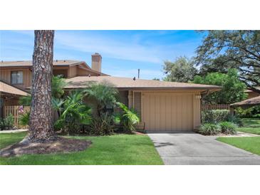 Charming single-Gathering home with a lush front yard and an attached two-car garage in a quiet neighborhood at 199 Heron Bay Cir, Lake Mary, FL 32746