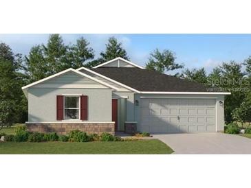 Charming single-story home featuring a two-car garage and well-maintained landscaping at 4737 Katrina Dr, Haines City, FL 33844