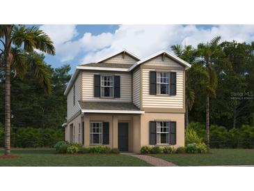 Charming two-story home with a combination of beige siding and stucco exterior and simple landscaping at 7256 Summer Ivy Aly, Orlando, FL 32829
