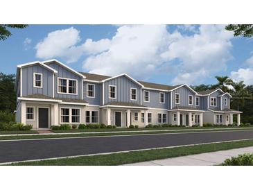 Charming new townhomes with a sidewalk and well-maintained landscaping for a welcoming curb appeal at 7358 Ivy Tendril Ave, Orlando, FL 32829