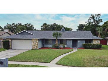 Charming single Gathering home with a well maintained lawn, stone accents, and a neutral paint scheme at 173 Tollgate Br, Longwood, FL 32750