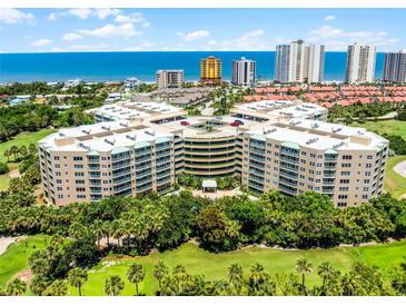 Stunning aerial view of a beachfront condo complex with lush landscaping and ocean views on a sunny day at 4 Oceans West Blvd # 502D, Daytona Beach Shores, FL 32118
