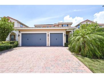 Beautiful home with a paved driveway and a convenient three-car garage at 10275 Henbury St, Orlando, FL 32832
