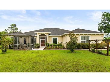 Beautiful single story home with a screened in lanai and well manicured landscaping at 18920 Overton St, Orlando, FL 32833